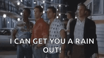 A Group Of Men Are Standing Next To Each Other On A Street And Talking . GIF