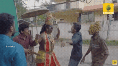 A Group Of Men Are Standing Next To Each Other On A Street . GIF