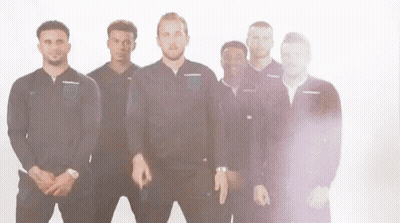 A Group Of Men Are Standing Next To Each Other On A White Background And Making Funny Faces . GIF