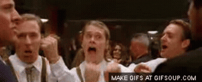 A Group Of Men Are Standing Next To Each Other With Their Mouths Open In A Crowd . GIF