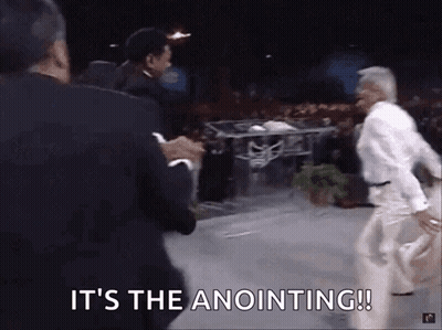 A Group Of Men Are Standing On A Stage With The Words It 'S The Anointing ! GIF