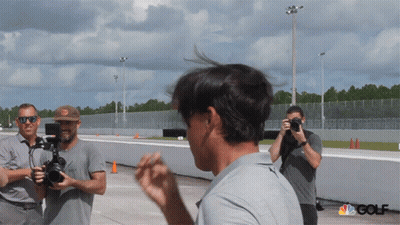 A Group Of Men Are Taking Pictures Of A Man With The Nbc Golf Logo In The Corner GIF