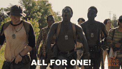 A Group Of Men Are Walking Down A Path And One Of Them Says " All For One " GIF