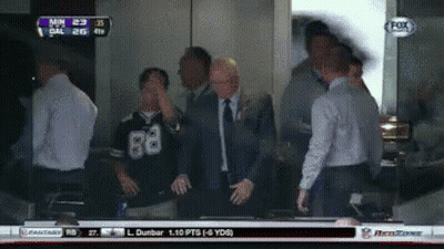 A Group Of Men Are Watching A Football Game On A Fox Channel GIF