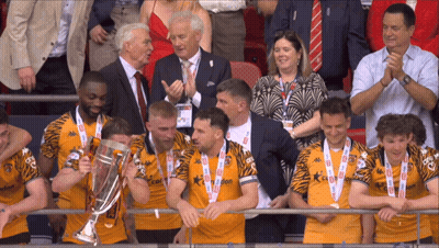A Group Of Men Holding A Trophy With The Number 10 On Their Jersey GIF