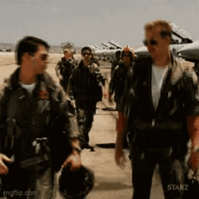 A Group Of Men In Military Uniforms Are Walking On A Runway .. GIF
