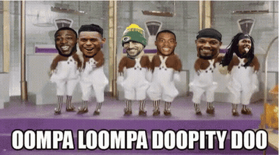 A Group Of Men In Overalls Are Dancing With The Words Oompa Loompa Doopity Doo GIF