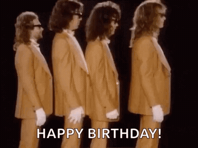 A Group Of Men In Suits And Gloves Are Standing Next To Each Other In A Line . GIF