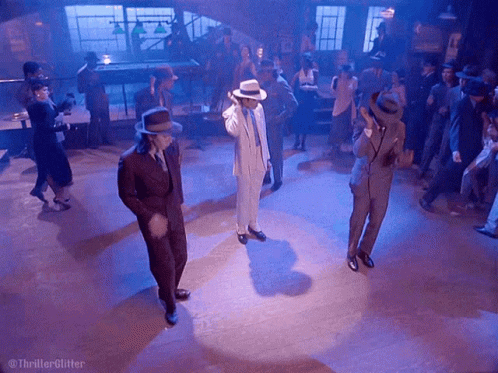 Men In Suits Dancing On Floor With Thriller Glitter GIF