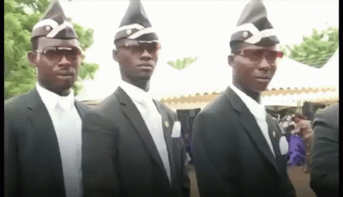 A Group Of Men In Suits And Hats Are Standing In A Line . GIF
