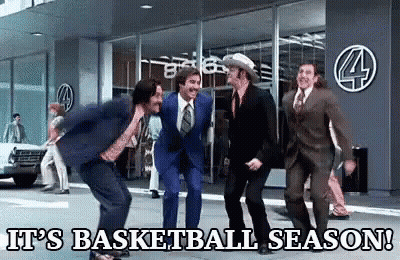 A Group Of Men In Suits And Ties Are Dancing On The Sidewalk . GIF