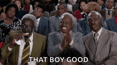 A Group Of Men In Suits And Ties Are Sitting In A Row Clapping . GIF