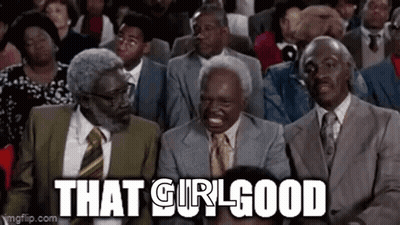 A Group Of Men In Suits And Ties Are Sitting In A Row Laughing . GIF