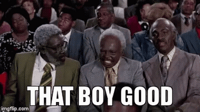 A Group Of Men In Suits And Ties Are Sitting In A Theatre . GIF