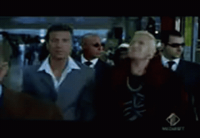 A Group Of Men In Suits Are Standing In Front Of A Window .. GIF