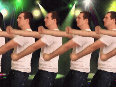 A Group Of Men In White Shirts Are Dancing In A Line GIF