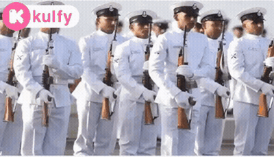 A Group Of Men In White Uniforms Are Standing In A Line With Their Guns .. GIF