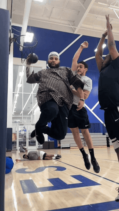 A Group Of Men Playing Basketball On A Court With The Letter L On The Floor GIF