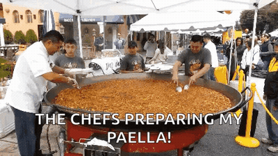 A Group Of Men Preparing Paella In A Large Pan With The Caption The Chefs Preparing My Paella GIF