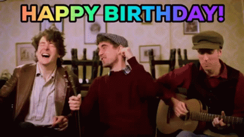 A Group Of Men Singing And Playing Guitars With The Words Happy Birthday In The Background GIF