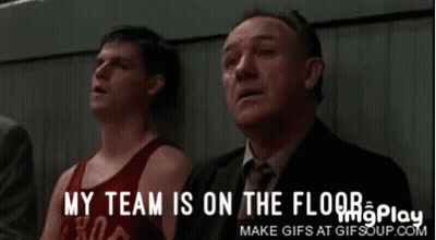A Group Of Men Sitting In A Stadium With The Words My Team Is On The Floor GIF