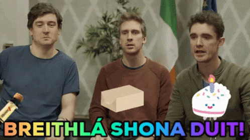 A Group Of Men Sitting Next To Each Other With The Words Breithla Shona Duit GIF