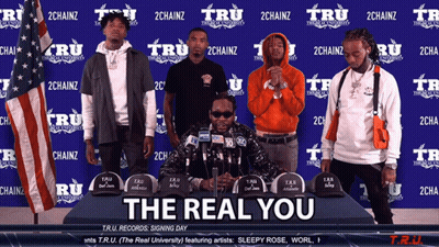 A Group Of Men Standing Around A Table With The Words The Real You On The Bottom GIF