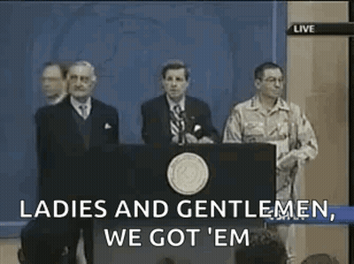 A Group Of Men Standing Behind A Podium With The Words `` Ladies And Gentlemen , We Got 'Em '' . GIF