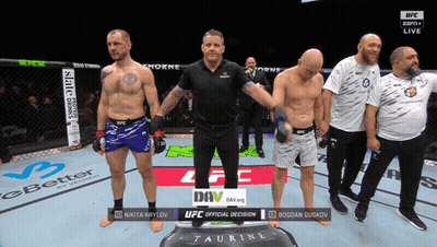A Group Of Men Standing In A Boxing Ring With The Words Ufc Official Decision On The Screen GIF