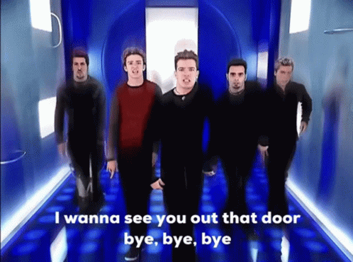 A Group Of Men Standing In A Hallway With The Words " I Wanna See You Out That Door Bye Bye Bye " GIF
