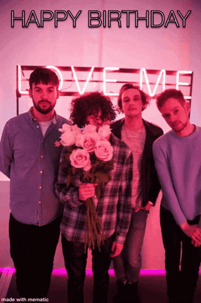 A Group Of Men Standing In Front Of A Love Me Sign GIF