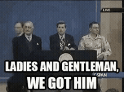 A Group Of Men Standing In Front Of A Podium With The Words Ladies And Gentleman We Got Him GIF