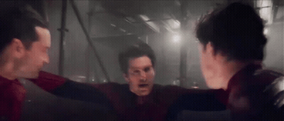 A Group Of Men Standing Next To Each Other In A Dark Room . GIF