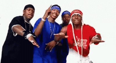 A Group Of Men Standing Next To Each Other With One Wearing A Red Shirt That Says ' Ford ' On It GIF