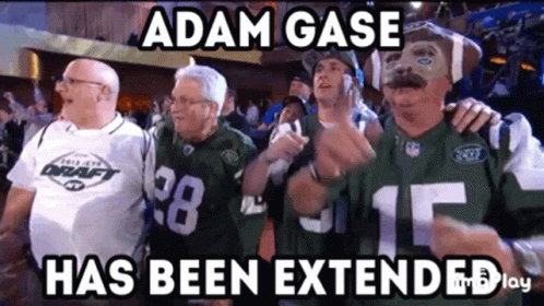A Group Of Men Standing Next To Each Other With The Caption Adam Gase Has Been Extended . GIF