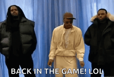 A Group Of Men Standing Next To Each Other With The Words `` Back In The Game ! Lol '' . GIF