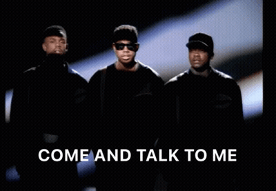 A Group Of Men Standing Next To Each Other With The Words Come And Talk To Me Above Them GIF