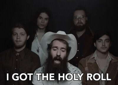 A Group Of Men Standing Next To Each Other With The Words I Got The Holy Roll GIF
