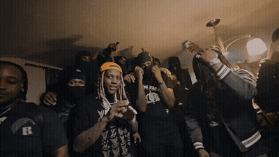 A Group Of Men Wearing Black Shirts With The Letter R On Them Are Dancing GIF
