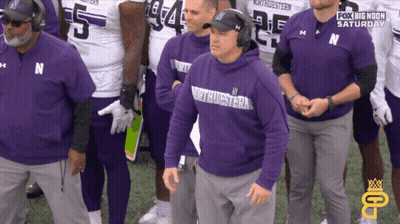 A Group Of Men Wearing Purple Shirts With The Word Northwestern On It GIF