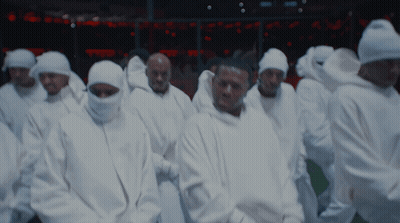 A Group Of Men Wearing White Hoodies With The Letter G On The Front GIF