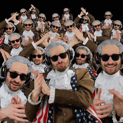 A Group Of Men Wearing Wigs And Sunglasses Are Dancing GIF