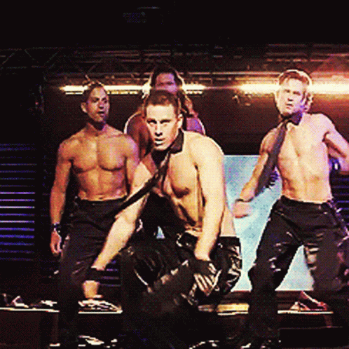 A Group Of Men Without Shirts Are Dancing On Stage GIF