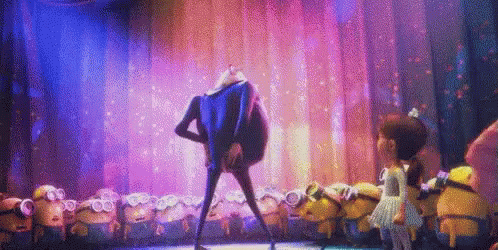 A Group Of Minions Are Dancing On A Stage With A Man In A Blue Suit . GIF