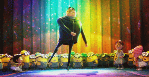 A Group Of Minions Are Standing Around A Stage With A Man Dancing On It GIF