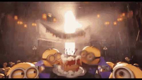 A Group Of Minions Are Standing In A Dark Room With A Light Shining Through The Ceiling . GIF