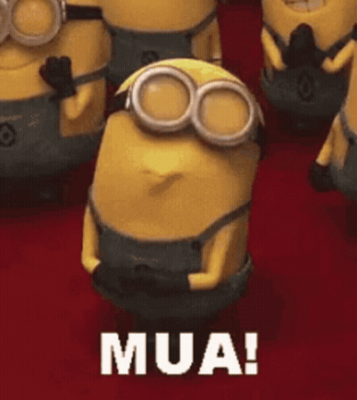 A Group Of Minions Are Standing Next To Each Other And One Of Them Is Saying Mua ! GIF