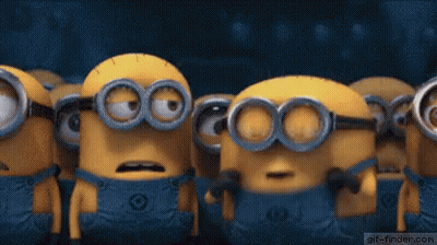 A Group Of Minions Are Standing Next To Each Other With Their Mouths Wide Open . GIF