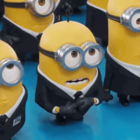Minions In Suits And Goggles Standing GIF