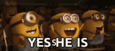 A Group Of Minions Standing Next To Each Other With The Words " Yes She Is " Written On The Bottom GIF